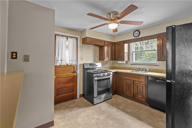 1031 Stratmore St, Ingram, PA 15205 - kitchen with black appliances, light countertops, ceiling fan, and brown cabinets