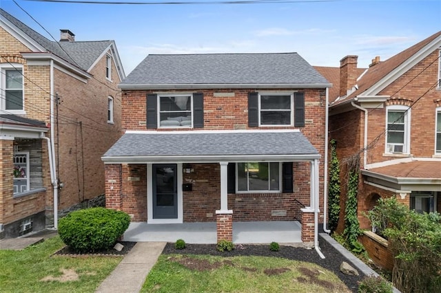 1822 Plainview Ave, Brookline, PA 15226 - traditional-style home featuring brick siding, roof with shingles, and covered porch
