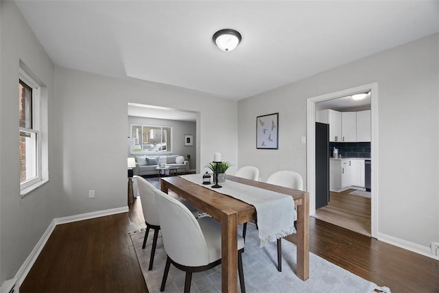 1822 Plainview Ave, Brookline, PA 15226 - dining room with healthy amount of natural light, wood finished floors, and a baseboard heating unit