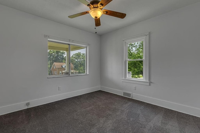 1586 Jackson St, Aliquippa, PA 15001 - spare room featuring dark carpet and a ceiling fan