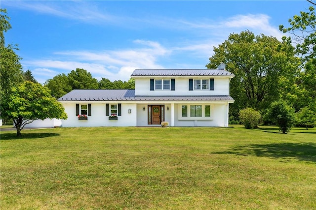 626 Solomon Temple Rd, Unity Twp, PA 15650 - view of front of property with a front yard, a chimney, a metal roof, and stucco siding