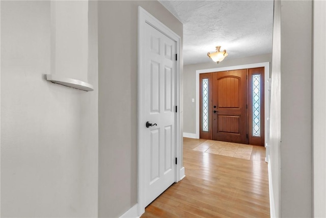 626 Solomon Temple Rd, Unity Twp, PA 15650 - foyer entrance with light wood-style flooring and a textured ceiling