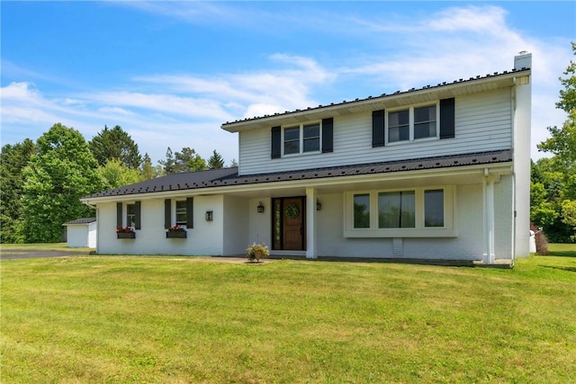626 Solomon Temple Rd, Unity Twp, PA 15650 - traditional home featuring a chimney, a front lawn, and brick siding