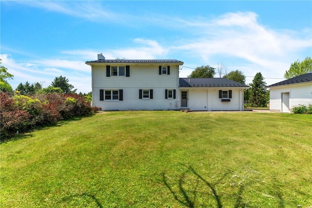 626 Solomon Temple Rd, Unity Twp, PA 15650 - back of property featuring a yard, a chimney, and a metal roof