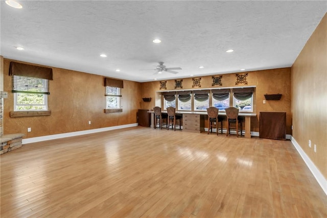 626 Solomon Temple Rd, Unity Twp, PA 15650 - living area featuring light wood-style floors, recessed lighting, built in study area, a ceiling fan, and a textured ceiling