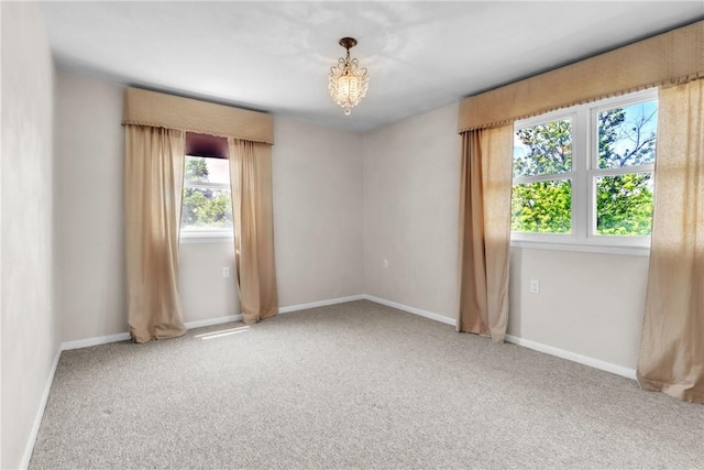 626 Solomon Temple Rd, Unity Twp, PA 15650 - carpeted empty room featuring baseboards and a chandelier