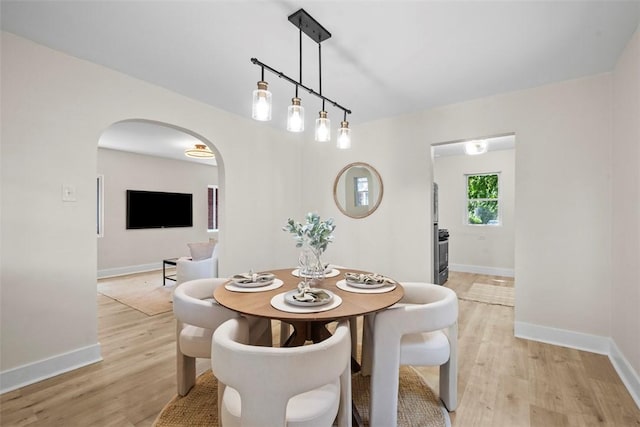 1313 Ingham St, Marshall Shadeland, PA 15212 - dining area featuring arched walkways and light wood-type flooring