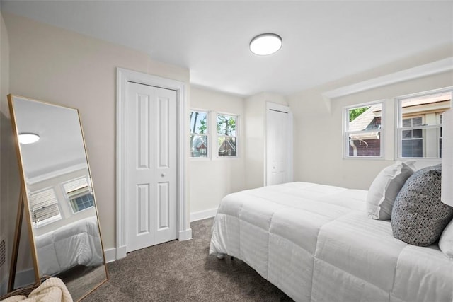 1313 Ingham St, Marshall Shadeland, PA 15212 - bedroom featuring multiple closets, dark colored carpet, and multiple windows