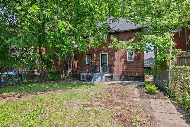 1313 Ingham St, Marshall Shadeland, PA 15212 - rear view of house with brick siding and a shingled roof
