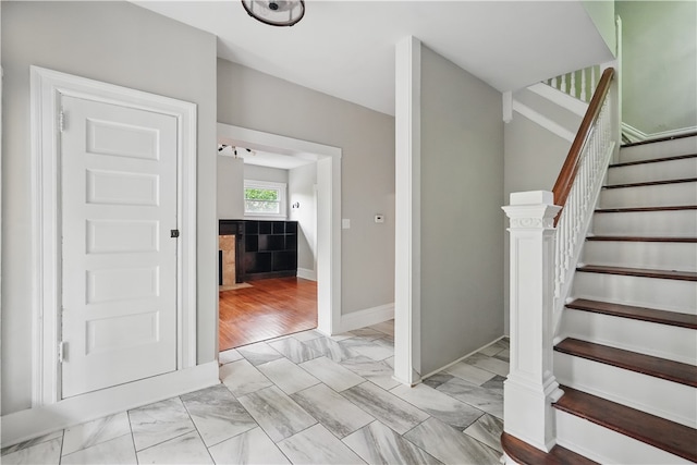 7504 Brighton Rd, Ben Avon, PA 15202 - stairs featuring marble look tile flooring and baseboards