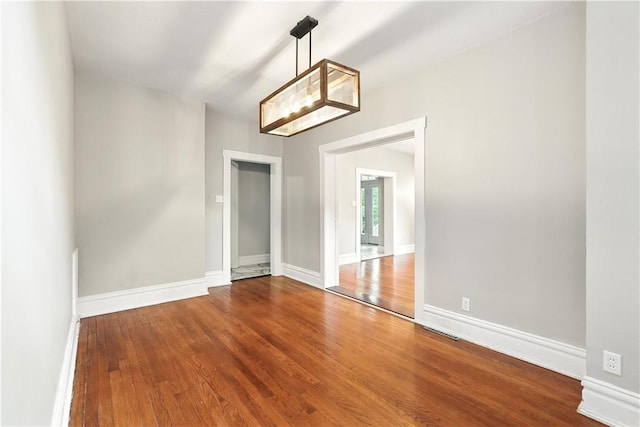 7504 Brighton Rd, Ben Avon, PA 15202 - unfurnished dining area with wood finished floors and baseboards