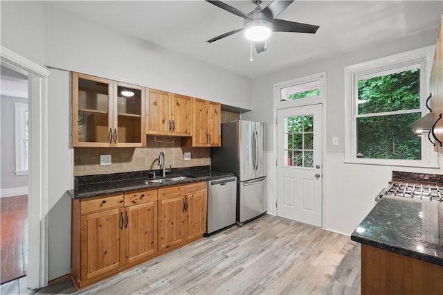 7504 Brighton Rd, Ben Avon, PA 15202 - kitchen featuring stainless steel appliances, light wood-style flooring, a ceiling fan, and backsplash