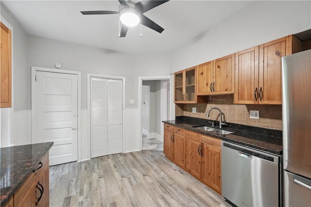 7504 Brighton Rd, Ben Avon, PA 15202 - kitchen featuring stainless steel appliances, ceiling fan, glass insert cabinets, tasteful backsplash, and light wood finished floors