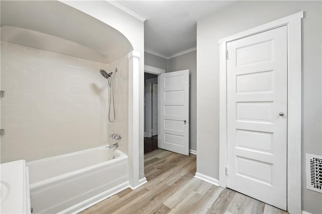 7504 Brighton Rd, Ben Avon, PA 15202 - bathroom with wood finished floors, bathing tub / shower combination, and crown molding