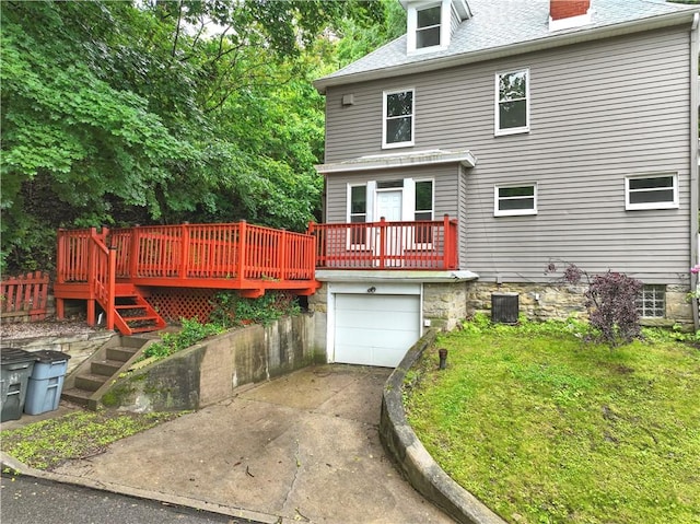 7504 Brighton Rd, Ben Avon, PA 15202 - rear view of property with driveway, a garage, a wooden deck, a chimney, and roof with shingles