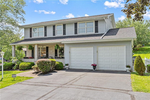 5 Robin Dr, South Strabane, PA 15301 - traditional-style house with asphalt driveway and a porch