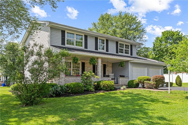 5 Robin Dr, South Strabane, PA 15301 - view of front facade featuring covered porch, a front yard, and an attached garage