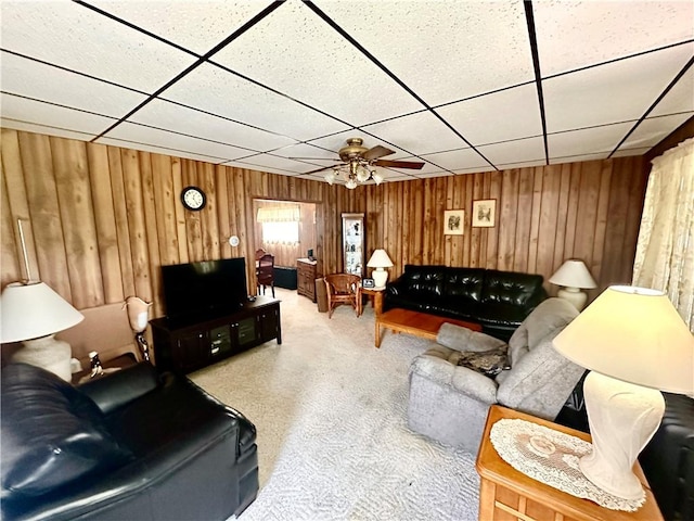 328 N Gallatin Ave, North Union Twp, PA 15401 - carpeted living area featuring a paneled ceiling, wood walls, and a ceiling fan