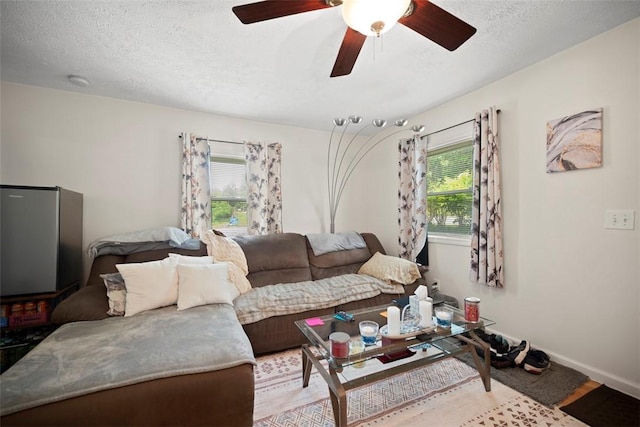 1153 Robinson Hwy, Robinson Twp Wsh, PA 15057 - living room featuring a ceiling fan and a textured ceiling