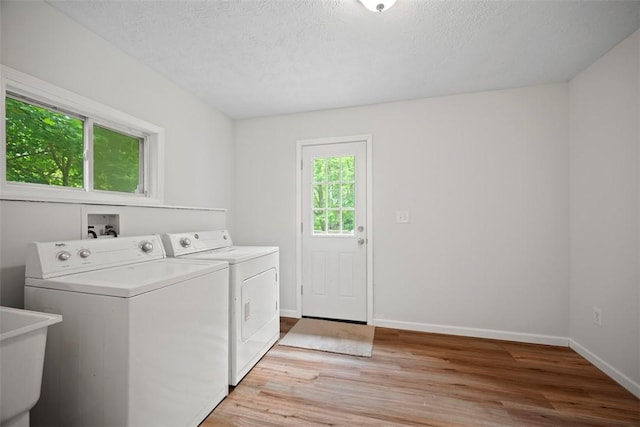 1153 Robinson Hwy, Robinson Twp Wsh, PA 15057 - laundry area with washing machine and dryer, light wood-type flooring, and a textured ceiling