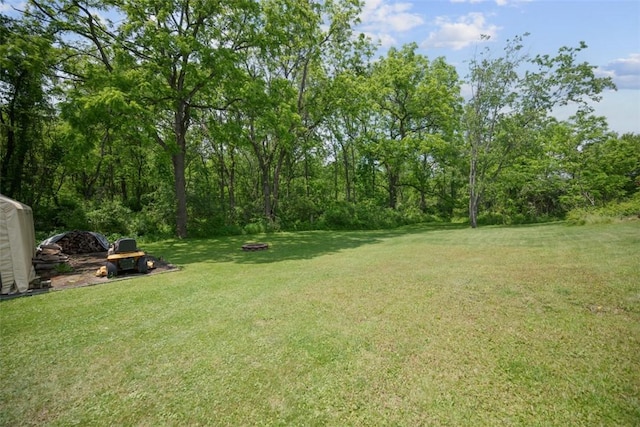 1153 Robinson Hwy, Robinson Twp Wsh, PA 15057 - view of grassy yard with an outdoor fire pit