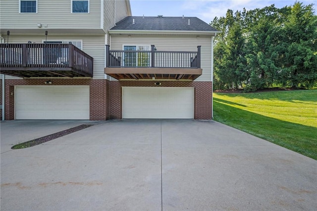 101 Creekside Dr, Buffalo Twp, PA 16055 - rear view of property with concrete driveway, a garage, a lawn, a balcony, and brick siding