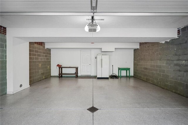 101 Creekside Dr, Buffalo Twp, PA 16055 - garage featuring concrete block wall and a garage door opener