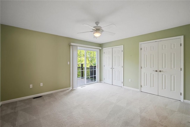 101 Creekside Dr, Buffalo Twp, PA 16055 - unfurnished bedroom featuring access to outside, carpet, multiple closets, and ceiling fan