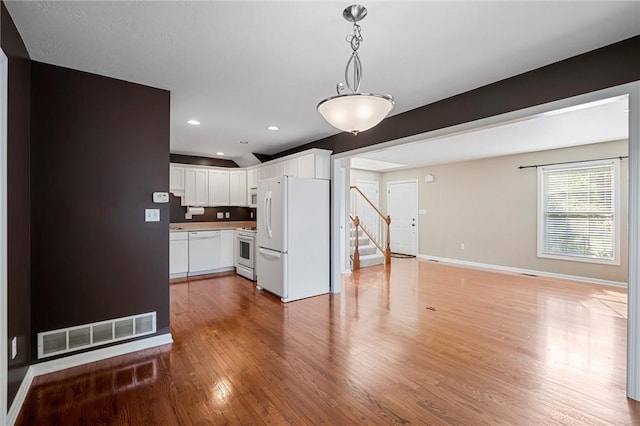 101 Creekside Dr, Buffalo Twp, PA 16055 - kitchen featuring white appliances, light wood-type flooring, pendant lighting, white cabinets, and recessed lighting