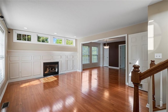 101 Creekside Dr, Buffalo Twp, PA 16055 - unfurnished living room with light wood-type flooring, a fireplace with flush hearth, recessed lighting, and stairs