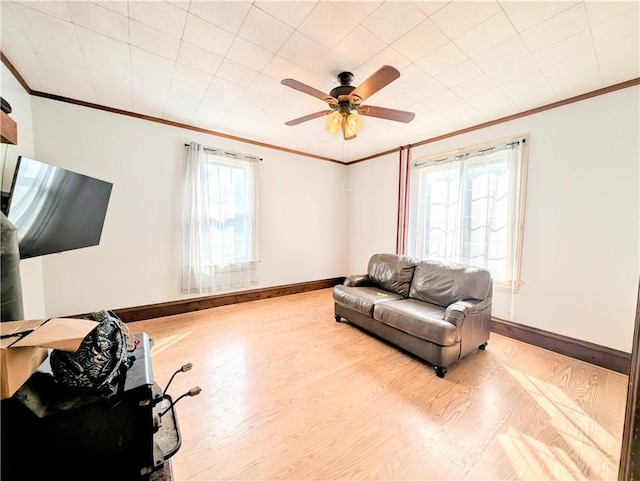 323 E 2nd St, Derry Boro, PA 15627 - living area featuring crown molding, wood finished floors, and a ceiling fan