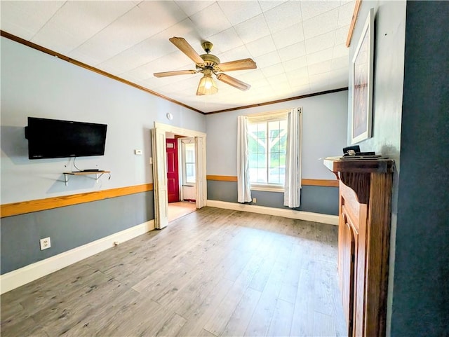 323 E 2nd St, Derry Boro, PA 15627 - unfurnished living room with crown molding, wood finished floors, and a ceiling fan