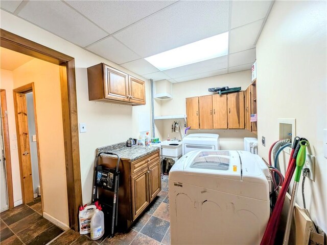 323 E 2nd St, Derry Boro, PA 15627 - laundry room featuring washer and clothes dryer, cabinet space, and dark stone finish floors