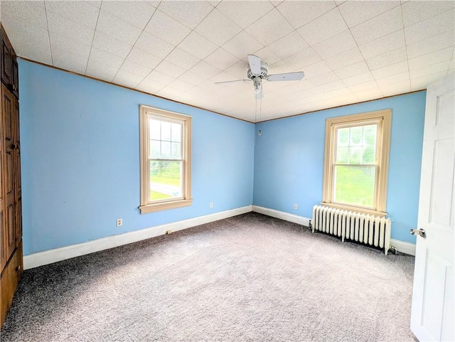 323 E 2nd St, Derry Boro, PA 15627 - carpeted spare room featuring radiator heating unit, healthy amount of natural light, and ceiling fan