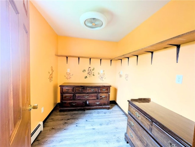 323 E 2nd St, Derry Boro, PA 15627 - interior space featuring a baseboard radiator and wood finished floors
