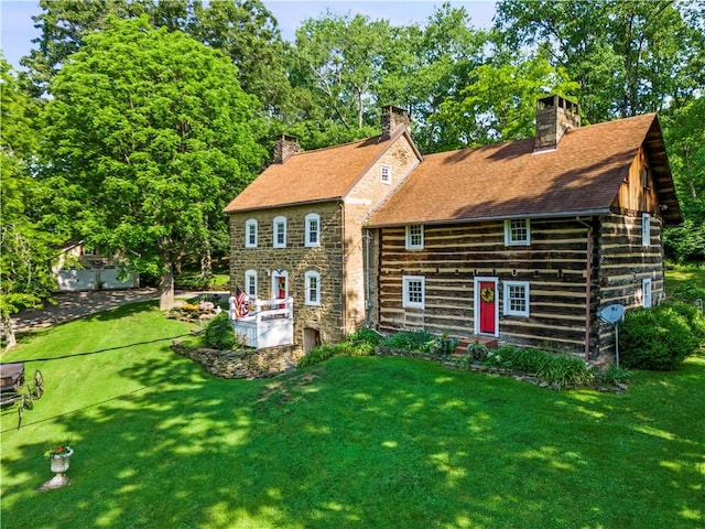 117 Havers Hill Rd, Jefferson/Mather, PA 15344 - back of house featuring a chimney, a lawn, and stone siding