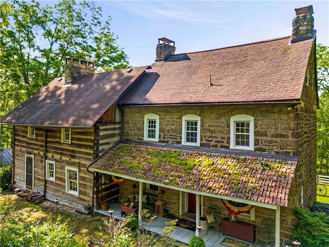 117 Havers Hill Rd, Jefferson/Mather, PA 15344 - back of house featuring stone siding, a chimney, and a wooden deck