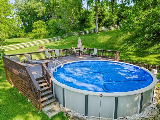 117 Havers Hill Rd, Jefferson/Mather, PA 15344 - view of swimming pool featuring a hot tub, a wooden deck, outdoor dining area, a fenced backyard, and view of scattered trees