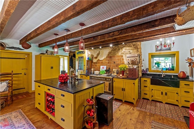 117 Havers Hill Rd, Jefferson/Mather, PA 15344 - kitchen with double oven range, light wood-style flooring, beamed ceiling, dark countertops, and a chandelier