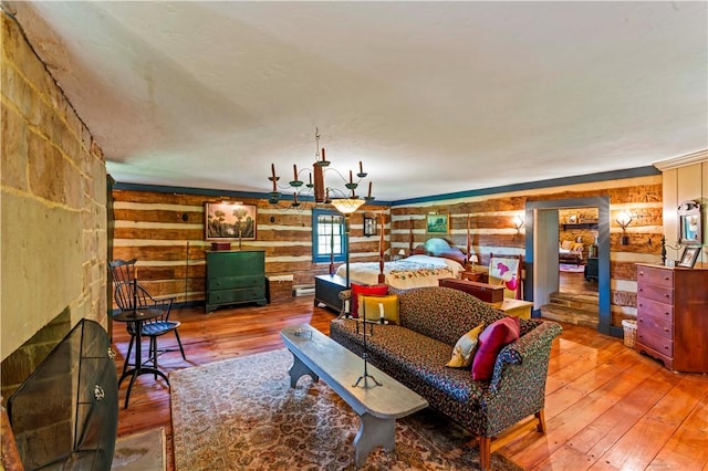 117 Havers Hill Rd, Jefferson/Mather, PA 15344 - living area featuring wood-type flooring, wood walls, and a baseboard radiator