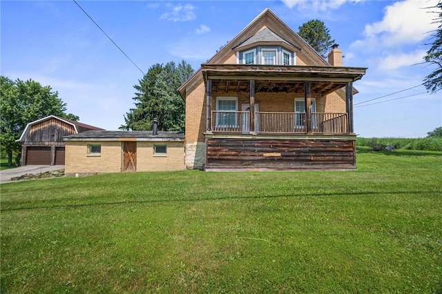 943 State Route 66, Gilpin Twp, PA 15690 - view of front facade featuring a front lawn, brick siding, and a chimney