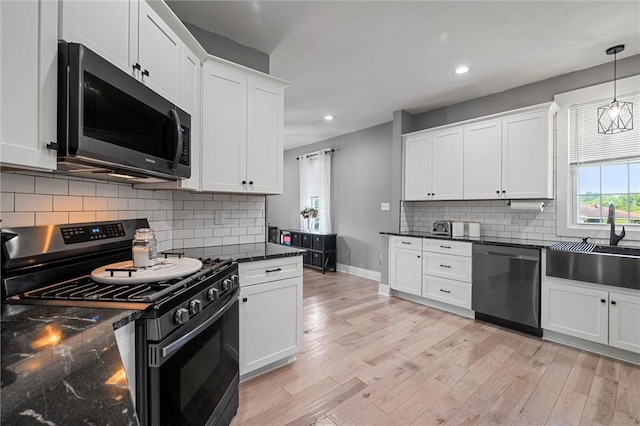 943 State Route 66, Gilpin Twp, PA 15690 - kitchen with gas stove, dishwasher, recessed lighting, white cabinets, and light wood finished floors