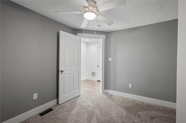 943 State Route 66, Gilpin Twp, PA 15690 - carpeted empty room featuring ceiling fan, a smoke detector, and a textured ceiling