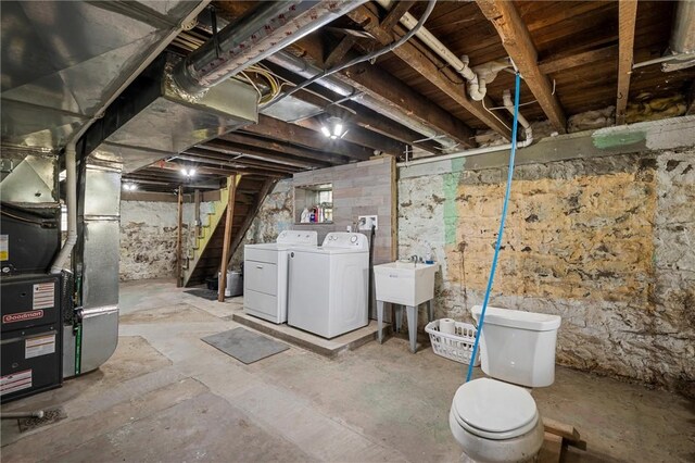 943 State Route 66, Gilpin Twp, PA 15690 - unfinished basement with washer and clothes dryer, heating unit, and stairway