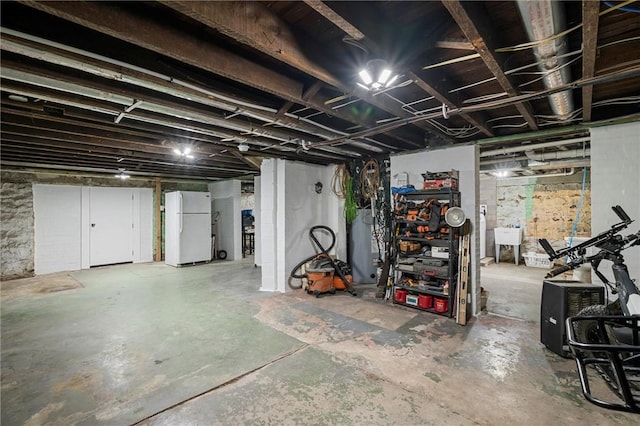 943 State Route 66, Gilpin Twp, PA 15690 - unfinished basement with freestanding refrigerator and a sink