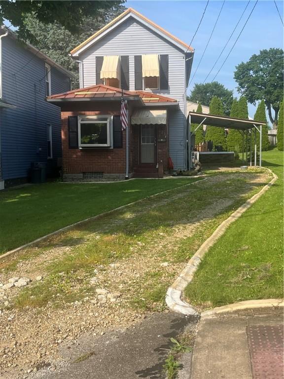 223 Hoeveler, Springdale Boro, PA 15144 - view of front of home featuring a front yard and a carport