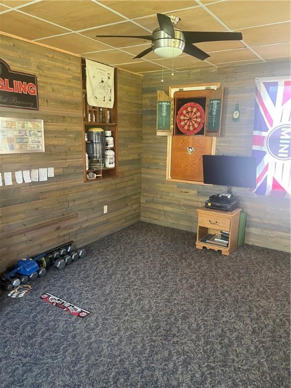 223 Hoeveler, Springdale Boro, PA 15144 - interior space with wood walls, ceiling fan, and carpet floors