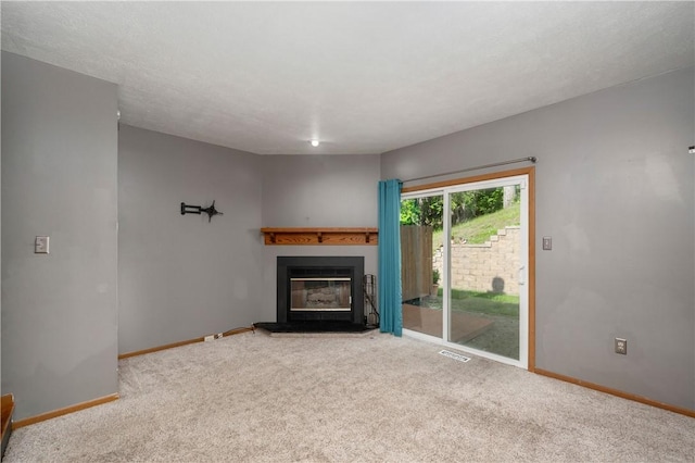 155 Spruce Ct, Ross Twp, PA 15229 - unfurnished living room with carpet flooring and a glass covered fireplace