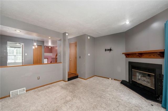 155 Spruce Ct, Ross Twp, PA 15229 - unfurnished living room with carpet, a glass covered fireplace, and recessed lighting