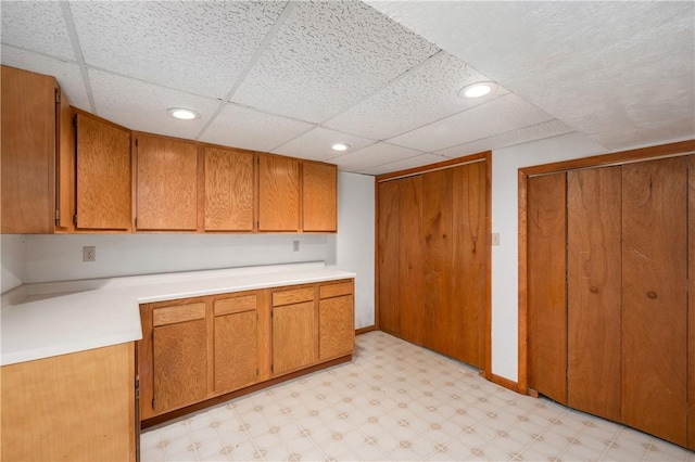 155 Spruce Ct, Ross Twp, PA 15229 - kitchen with light flooring, brown cabinets, light countertops, recessed lighting, and a drop ceiling